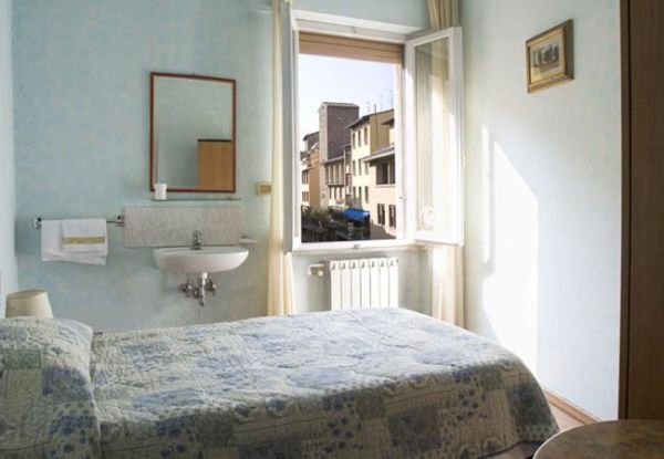 blue hotel room with open window