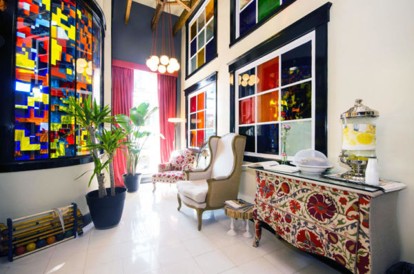 lobby with patterned sofa, wall art and industrial lighting