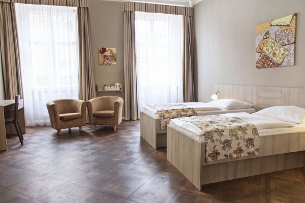 tan hotel room with huge windows