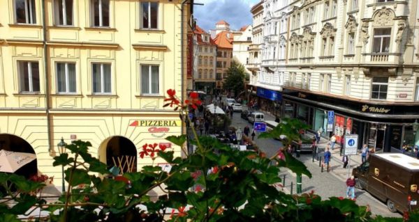 window with flower box overlooking streets of Prague