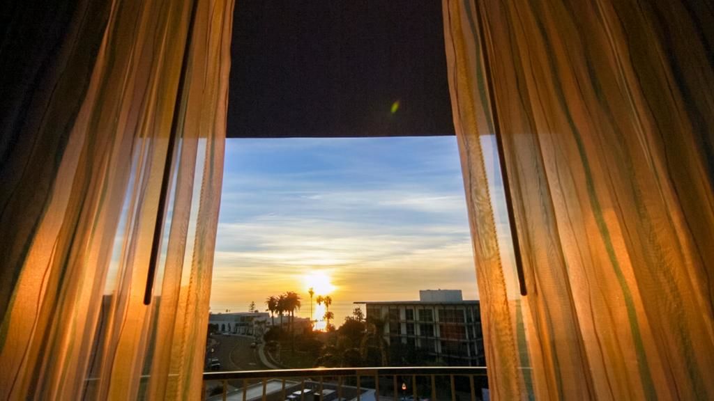 window revealing sunset over La Jolla Cove