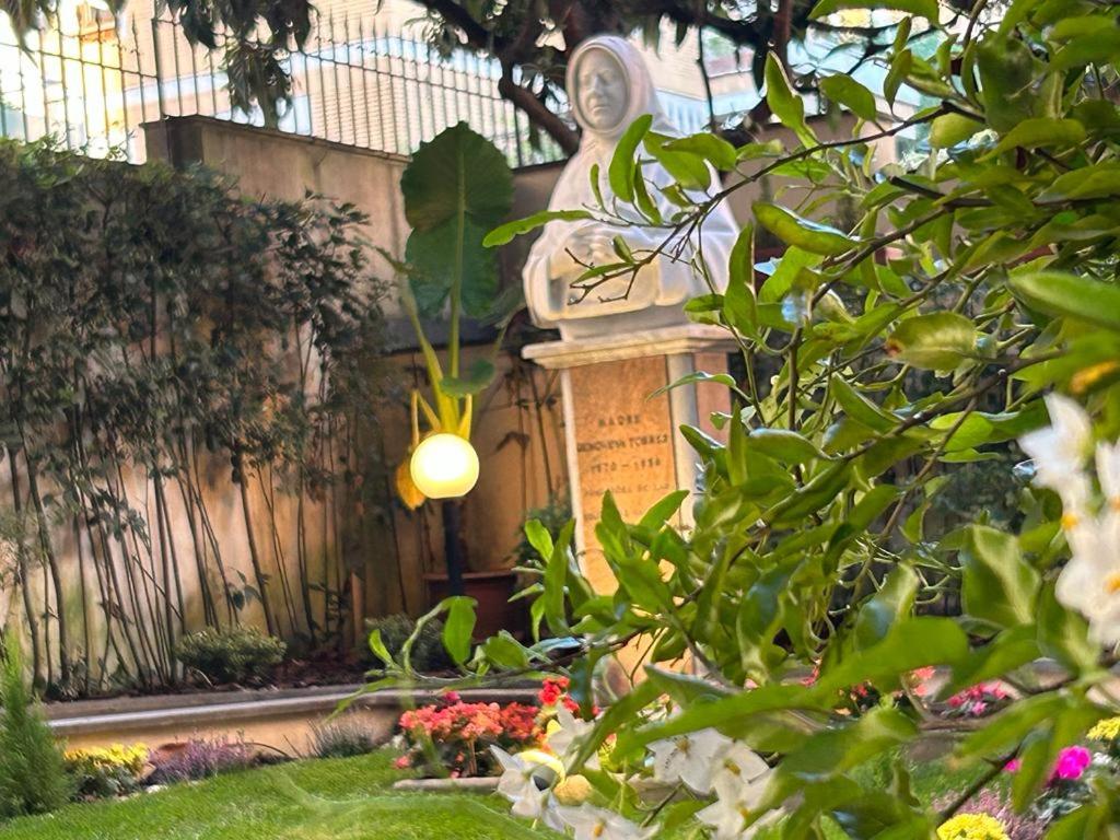 religious statue in garden at Villa Angeli - Casa per Ferie convent, one of Rome's cheapest sleeps