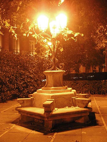 Benches line the Paseo del Prado connecting the Plaza de Cibeles and Plaza de Canovas del Castillo